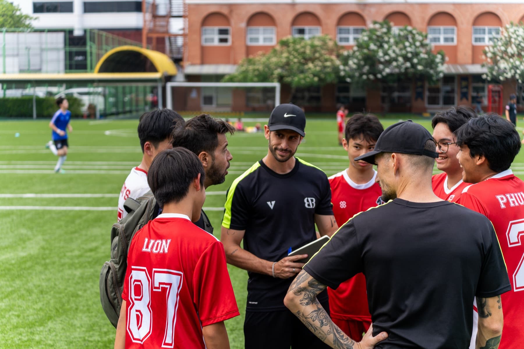 Bench interaction with a Regents player during a fixture