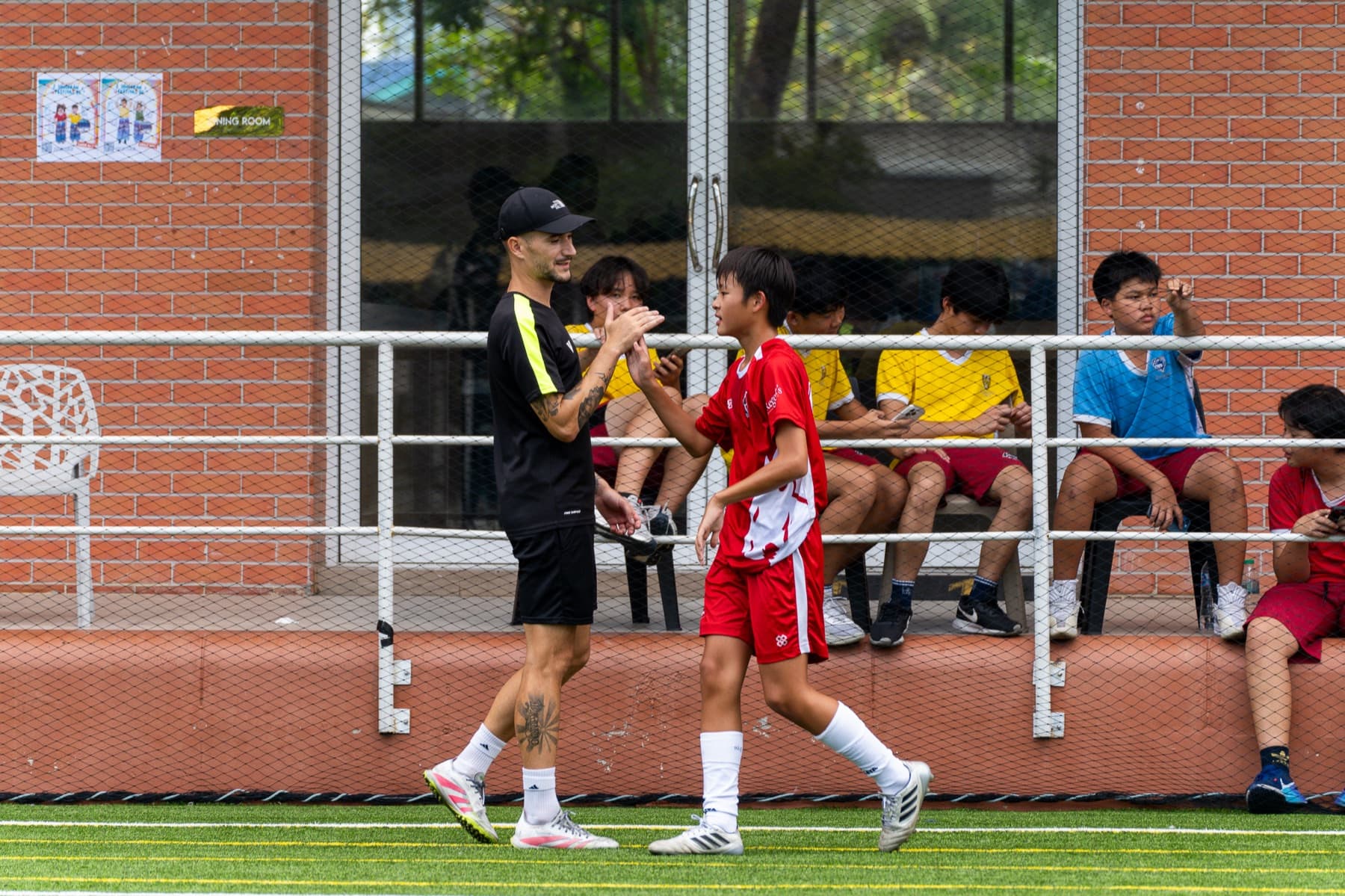 Team huddle before a match at Regents International School