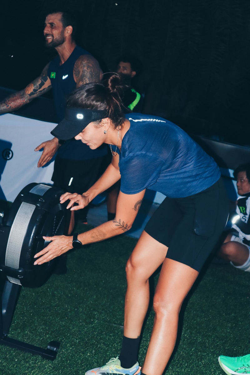 Rowing with a coach watching